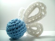 two crocheted balls are shown next to each other