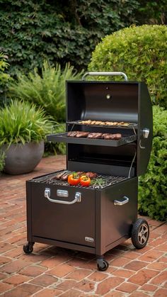 an outdoor bbq grill with two trays on it and some food in the middle