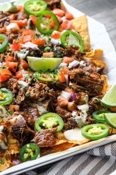 Loaded Mexican Nachos, Shredded Beef Nachos Recipes, Brisket Nachos Recipes, Griddle Nachos, Fancy Nachos, Beef Brisket Nachos, Bar Food Ideas Restaurant, Barbacoa Nachos, Best Nachos Recipe