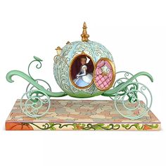 a figurine of a princess riding in a carriage