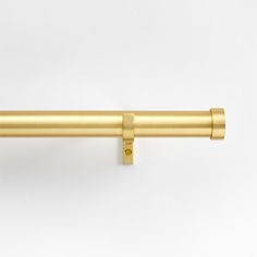 a gold curtain rod on a white background