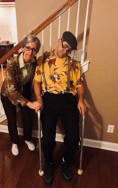 an older man and woman dressed up in costumes