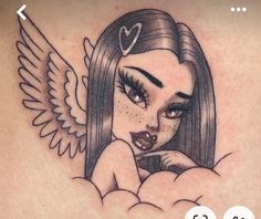 a girl with an angel tattoo on her stomach