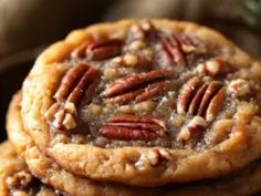 three pecan cookies stacked on top of each other