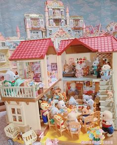 a doll house filled with lots of toys