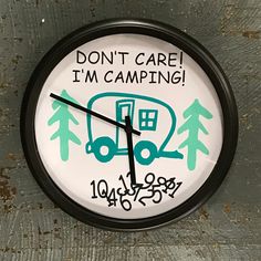 a clock with the words don't care i'm camping written on it