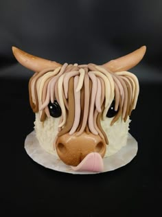 a cake decorated to look like a cow's head