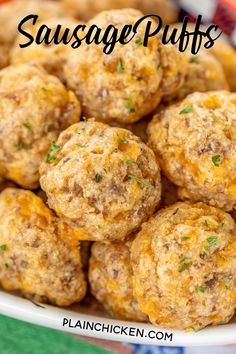 a white bowl filled with meatballs on top of a green and blue table cloth