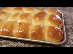 a pan filled with bread on top of a counter