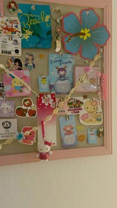 a bulletin board with many different items attached to it's sides and hanging on the wall