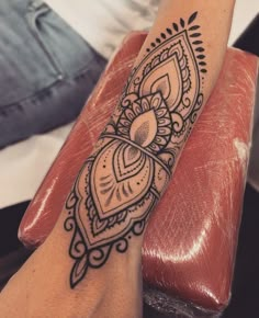 a woman's arm with a tattoo on it