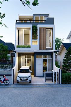 a car is parked in front of a two story house