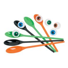 an assortment of spoons with different colored eyeballs on them, all in the same design