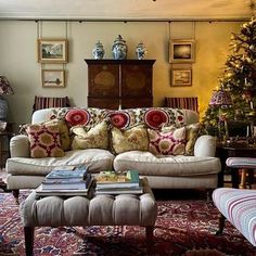 a living room filled with furniture and a christmas tree