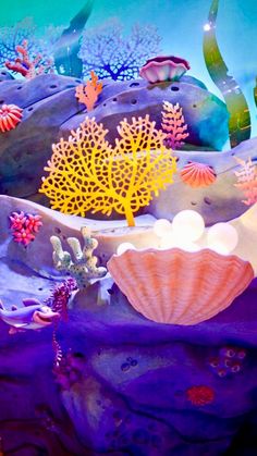 an underwater scene with colorful corals and seaweed