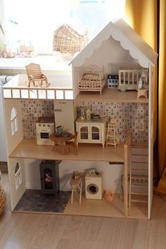 a doll house with furniture and accessories in it