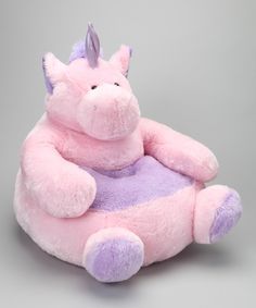 a pink and purple stuffed animal sitting on top of a chair