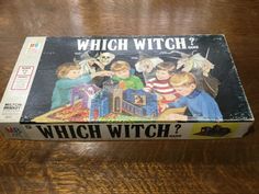 the box for which witch board game is in it's original cardboard case, on a wooden table