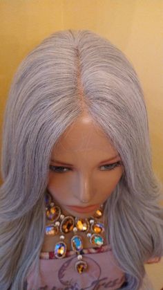 Looking for a stunning and high-quality wig that will make heads turn? Look no further than our Platinum Silver Wavy Lace Front Wig! This amazing wig features HD Lace and a Platinum Silver color that is sure to make you stand out from the crowd. With its long synthetic hair and wavy texture, this wig is perfect for cosplay parties or any special occasion where you want to make a statement. But the benefits of this wig go beyond just its stunning appearance. It's also incredibly comfortable to we Amazing Wig, Gray Wigs, Gray Wig, Hd Lace Wig, Flat Iron Curls, Grey Wig, High Quality Wigs, Hair Fibers, Synthetic Wig