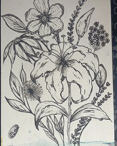 a drawing of some flowers on a piece of paper