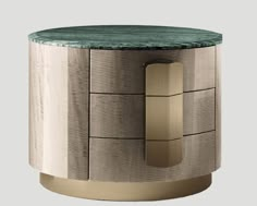 a round table with a green marble top and gold metal base, on a gray background