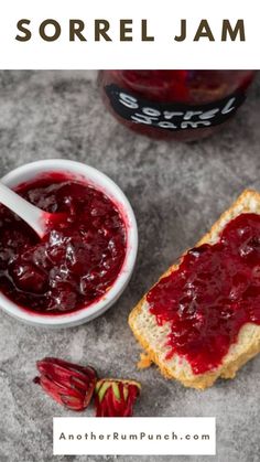 a bowl of jam next to a piece of bread