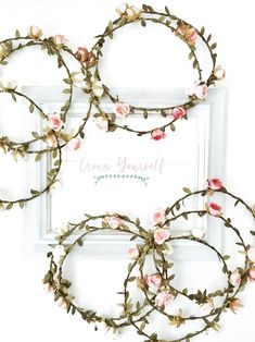 four wreaths with flowers and leaves are arranged in front of a white frame that says grow yourself