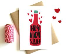 a card with the words hey hot stuff on it next to a spool of twine