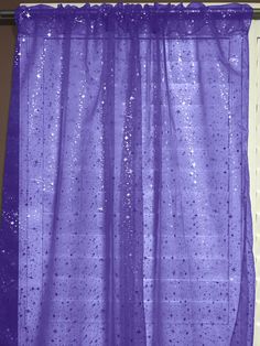 a purple shower curtain with water drops on it