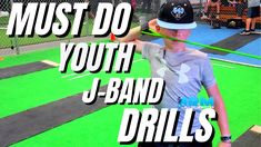 a young boy holding a baseball bat on top of a green and black field with the words must do youth j - band drills