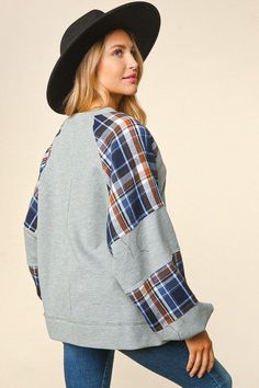 Stay warm and stylish with this Thermal Knit Plaid Sleeve Top! The solid thermal knit body with woven color block plaid and bubble long sleeves make it the perfect cozy winter look. You'll be snug as a bug in this loose fit, round-neck style! 65% Polyester, 35% Cotton Knit Plaid, Plaid Sleeve, A Bug, Gift Boutique, Cozy Winter, Winter Accessories, Winter Looks, Scarf Styles, Keep Warm