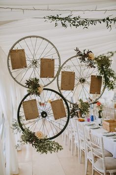 wedding decorations hanging from the ceiling in a marquee