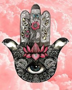 a hamsa with two birds on top of it in the sky and pink clouds