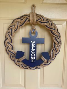 a wreath with an anchor is hanging on the door