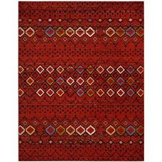 a red rug with many different colors and patterns