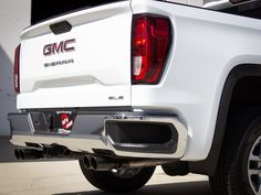 the back end of a white gmc sierra truck