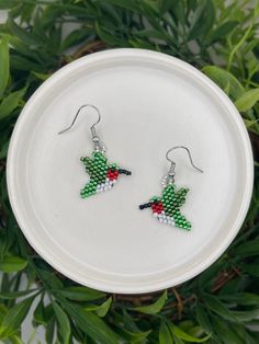 Small beaded hummingbird earrings made with Miyuki Delica beads. They measure 1/2" wide x 3/4" tall (not including the ear hook). They are light and easy to wear. Beaded Hummingbird, Bead Animals, Hummingbird Earrings, Chore Charts, Miyuki Delica Beads, Bird Earrings, Beaded Animals, Delica Beads, Ear Hook