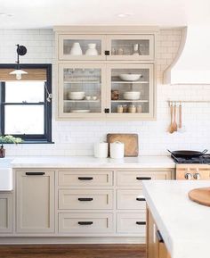 a kitchen filled with lots of white counter top space