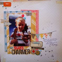 a scrapbook page with an image of a boy holding a snake in his hand