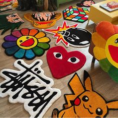 various pokemon themed rugs on the floor