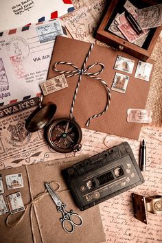 an assortment of old fashioned items on top of a piece of paper and envelopes