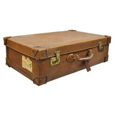 Antique Vintage English Brown Leather 28” Suitcase Hard Luggage. Item features quality leather construction, original travel stickers, unlocked no key, very nice vintage item. Circa Early 1900's. Measurements: 9" H x 28" W x 17" D. Vintage Brown Leather Briefcase With Luggage Sleeve, Luxury Vintage Brown Luggage, 1930s Luggage, Vintage Brown Rectangular Luggage, Leather Suitcase Vintage, Cartier Panthere, Settee Sofa, Deco Luminaire, Wall Sconces Bedroom