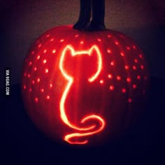 a carved pumpkin with a cat on it