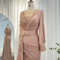 Desert Rose Brilliance: Long-Sleeved Rose Gold Mermaid Evening Gown - – Larosabride Luxury Satin Gown For Reception, Luxury Party Gown With Lace Trim, Luxury Formal Evening Dress With Zari Work, Luxury Lace Gown For Parties, Luxury Dola Silk Gown For Reception, Luxury Gown With Lace Sleeves For Women, Luxury Pink Lace Dress For Formal Occasions, Luxury V-neck Gown For Romantic Evening, Luxury Elegant Beige Lace Dress