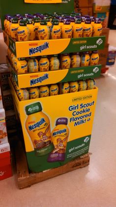 several boxes of nestil are stacked on top of each other in a grocery store