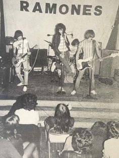 an old black and white photo of some people on stage