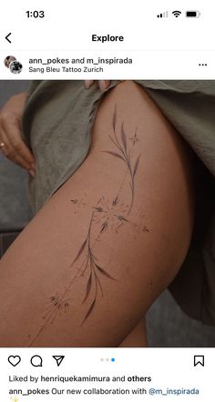 a woman's thigh with tattoos on it