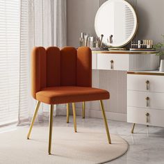 an orange chair sitting in front of a mirror on top of a white rug next to a dresser