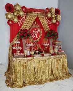 a table topped with lots of gold and red decorations