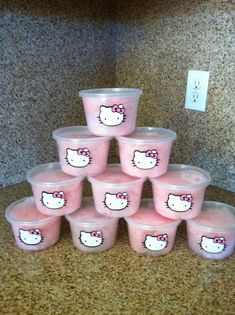 hello kitty cups are stacked on top of each other